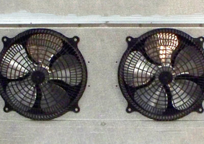 two dark grey fridge fans