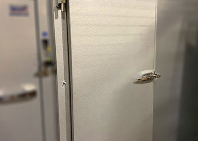 a silver cooler door
