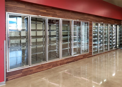 wall of glass coolers with empty racks inside