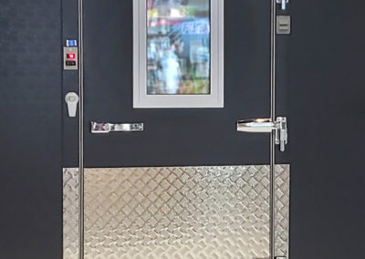 front view of a cooler door with a small window in it